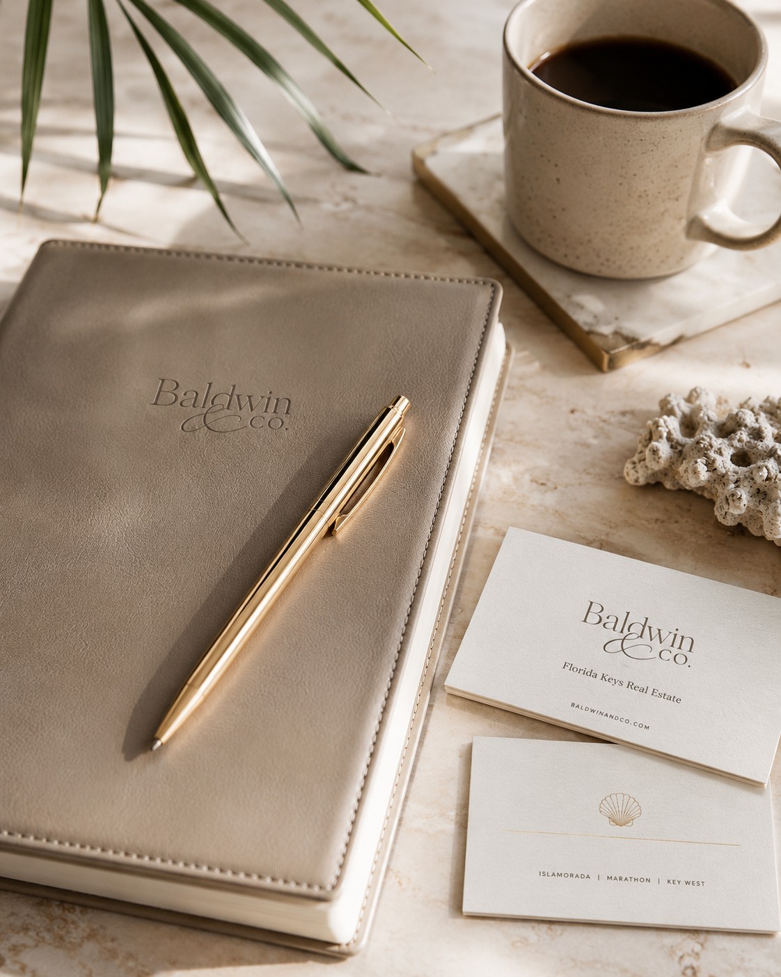 Baldwin & Co. notebook and pen on a desk